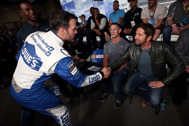 Jimmie Johnson greets Grand Marshal Gerard Butler.